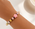 Pulsera rosa con flor de cerámica